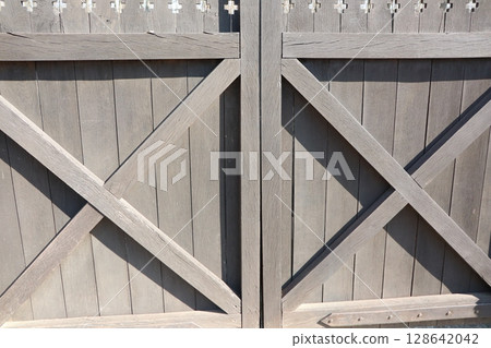 Rustic Wooden Gate that features Beautiful Decorative Elements and Unique Craftsmanship Rustic Wooden Gate that features Beautiful Decorative Elements and Unique Craftsmanship 128642042