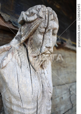 An Intricate Wooden Sculpture Depicting a Figure, Rich in Detail and Artistic Craftsmanship 128642045