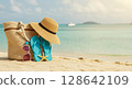 Straw hat standing on the beach (enjoying summer vacation) 128642109