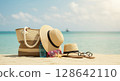 Straw hat standing on the beach (enjoying summer vacation) 128642110