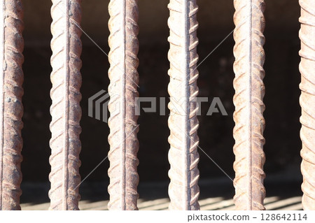 Rustic Metal Bars featuring Texture and Shadows in a Detailed Closeup Perspective View 128642114
