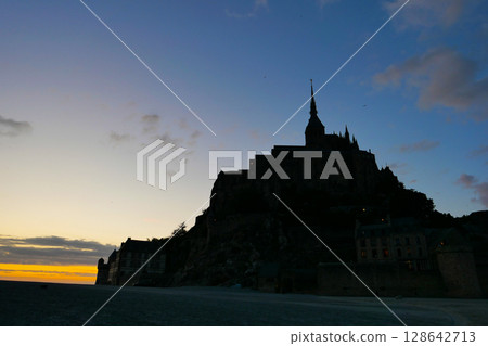 Mont Saint-Michel and the tidal flats in the setting sun Mont Saint-Michel and the tidal flats in the setting sun 128642713