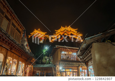 Illuminated pagodas at night in Dukezong Ancient Town, Shangri-La, China 128642807