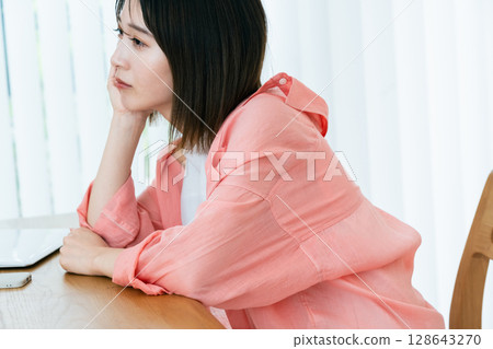 Digital-tired young woman Digital-tired young woman 128643270