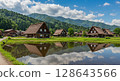 Shirakawa-go Gassho-zukuri style houses reflected in the rice fields in summer 128643566