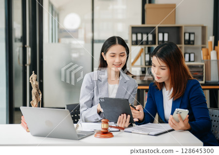 Asian Business law concept, Lawyer business lawyers are consulting lawyers for women entrepreneurs to file copyright lawsuit 128645300