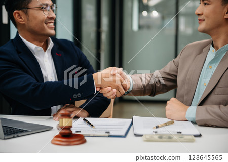 Business law concept, Lawyer business lawyers are consulting lawyers for women entrepreneurs to file copyright lawsuit with laptop and tablet at office 128645565