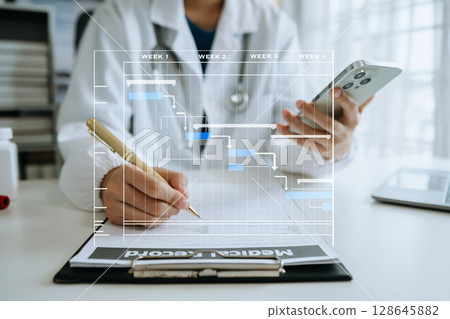 Project manager working and update tasks with Gantt chart scheduling diagram at hospital .success smart medical doctor working with smart medical doctor  concept. 128645882