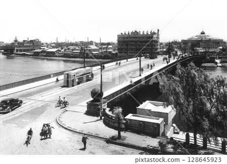 Old photo, 1933-1945, Tokyo, Ryogoku Bridge over the Sumida River and Ryogoku Kokugikan Sumo Hall 128645923