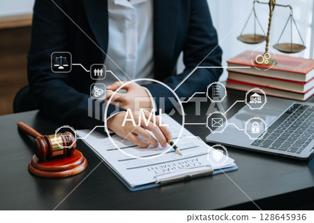 AML Anti Money Laundering Financial Bank Business Concept. judge in a courtroom using laptop and tablet with AML anti money laundering icon on virtual screen. AML Anti Money Laundering Financial Bank Business Concept. judge in a courtroom using laptop and tablet with AML anti money laundering icon on virtual screen. 128645936