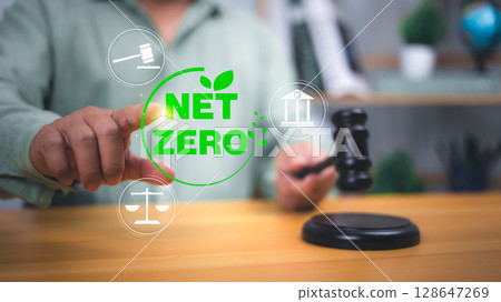 Net zero and climate law concept showing a judge with gavel and legal icons, symbolizing environmental policy, justice, and carbon neutrality regulations. Net zero and climate law concept showing a judge with gavel and legal icons, symbolizing environmental policy, justice, and carbon neutrality regulations. 128647269