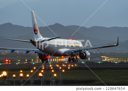 Sendai Airport at dusk, airplane taking off, Natori City, Miyagi Prefecture 128647654