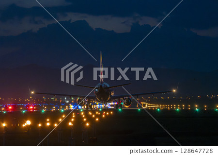 Sendai Airport at night, plane taking off, Natori City, Miyagi Prefecture Sendai Airport at night, plane taking off, Natori City, Miyagi Prefecture 128647728