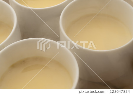 Freshly steamed custard pudding 128647824