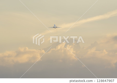 Sendai Airport at dusk: Planes taking off and cumulonimbus clouds, Natori City, Miyagi Prefecture 128647907
