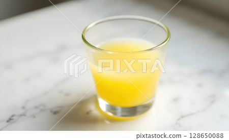 Tangy Lime Juice with Slice in Elegant Glass 128650088