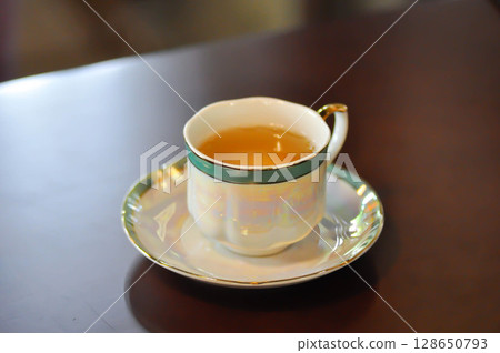 hot tea , tea cup and tea pot 128650793