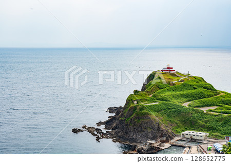 The cliffs of the cliffs of the cliffs and the horizon seen in the distance 128652775