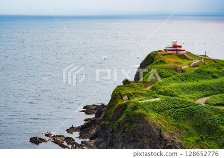 The cliffs of the cliffs of the cliffs and the horizon seen in the distance The cliffs of the cliffs of the cliffs and the horizon seen in the distance 128652776