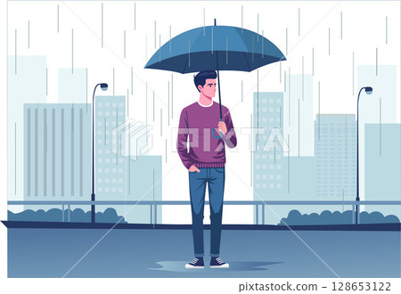 A young man stands with an umbrella in the rain. 128653122