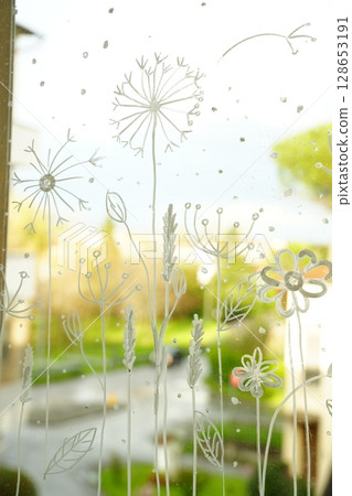 Floral Art on Window Glass Capturing Outdoor Beauty 128653191