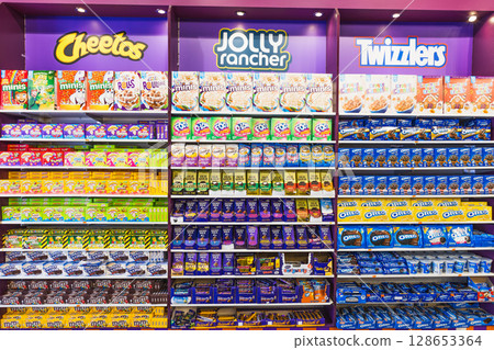 Store Confectionery Section with Branded Snacks and Chocolate Bars. London, UK, 2 June 2024 128653364