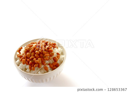 Rice topped with natto on white background Rice topped with natto on white background 128653367