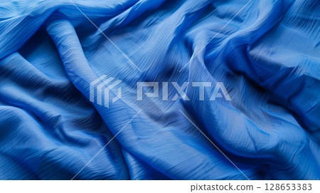 明亮的藍色織物紋理背景 128653383