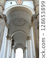 Historic architectural detail of an arch-shaped house facade in Prague, Czech Republic. 128653899