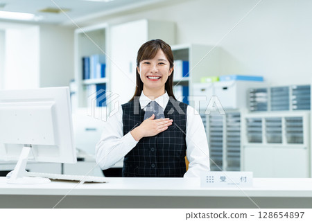 Business woman at the reception Business woman at the reception 128654897