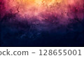 Textured abstract background with gradient of warm orange, pink, purple, and dark blue hues 128655001