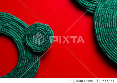 Abstract background of threads woven in a circle, on a bright background. Natural materials as a concept of handcraft Abstract background of threads woven in a circle, on a bright background. Natural materials as a concept of handcraft 128655274