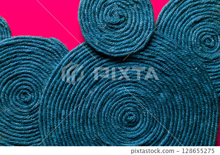 Jute twine macro shot. Texture of coarse thread. Cord background for packaging or crafts. Eco-friendly material for handicrafts Jute twine macro shot. Texture of coarse thread. Cord background for packaging or crafts. Eco-friendly material for handicrafts 128655275