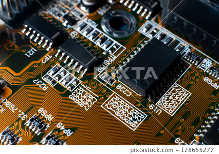 Small microprocessor, microcontroller chip on a generic modern desktop PC computer motherboard, object macro, extreme closeup, shallow dof, nobody Electrical components shortage concept, circuit board 128655277
