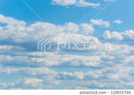 Blue sky background with white clouds. 128655786