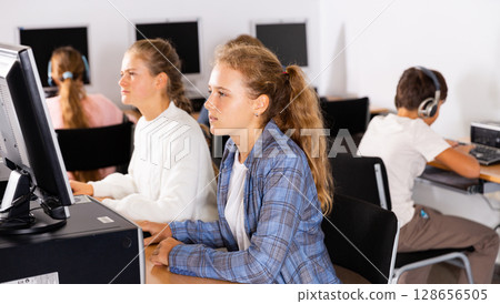 Teenagers in computer class 128656505
