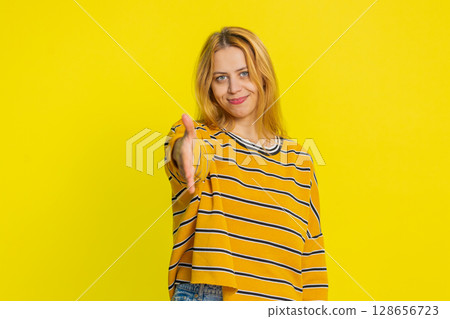 Caucasian woman outstretching hand to camera, offering handshake, greeting, invitation, welcoming 128656723