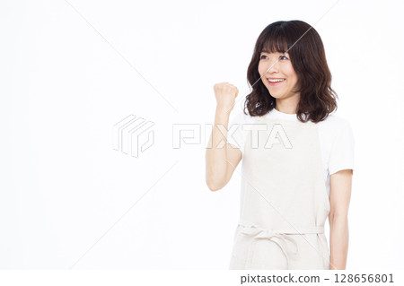 A housewife doing a fist pump A housewife doing a fist pump 128656801