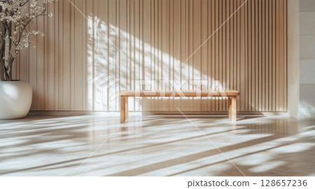 Sunlit wooden benches casting shadows in serene interior 128657236