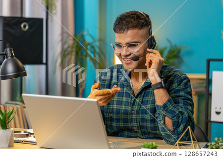 Business man wearing headset freelance worker call center or support service operator helpline 128657243