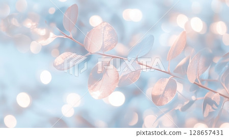 Elegant metallic leaves with bokeh effect in soft blue 128657431