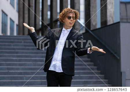 Confused business man feeling embarrassed about ambiguous question, having doubts, no answer idea 128657643