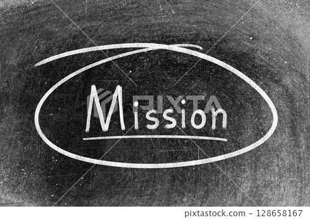 White chalk hand writing in word mission and circle shape on blackboard background White chalk hand writing in word mission and circle shape on blackboard background 128658167