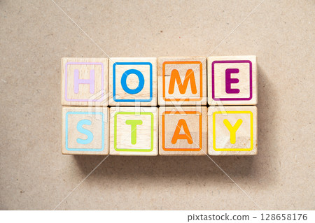 Alphabet letter block in word home stay on wood background Alphabet letter block in word home stay on wood background 128658176