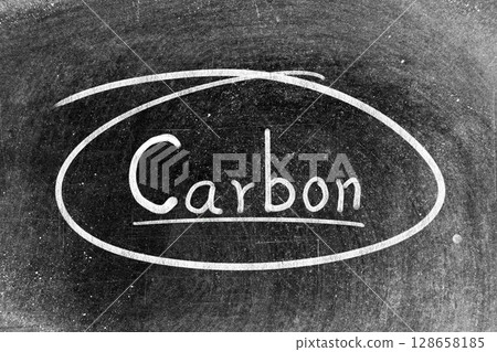 White chalk hand writing in word carbon and circle shape on blackboard background 128658185