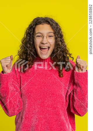 Happy Caucasian girl celebrate success winning birthday lottery jackpot goal achievement good news 128658862