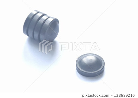 black circle magnet element arranging on white background black circle magnet element arranging on white background 128659216