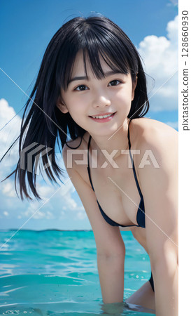 Smiling young woman in bikini swimsuit on summer beach 128660930