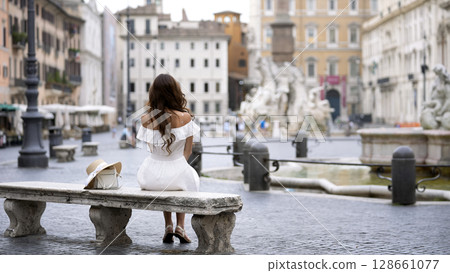 Tourist in summer attire relaxing in Piazza Navona Rome 2025 Tourist in summer attire relaxing in Piazza Navona Rome 2025 128661077