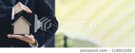 Banner Real estate agent hands holding home business mortgage loan investment property. Banner Hands saving protection home concepts. Insurance Agent sale residence household protection copy space Banner Real estate agent hands holding home business mortgage loan investment property. Banner Hands saving protection home concepts. Insurance Agent sale residence household protection copy space 128661089